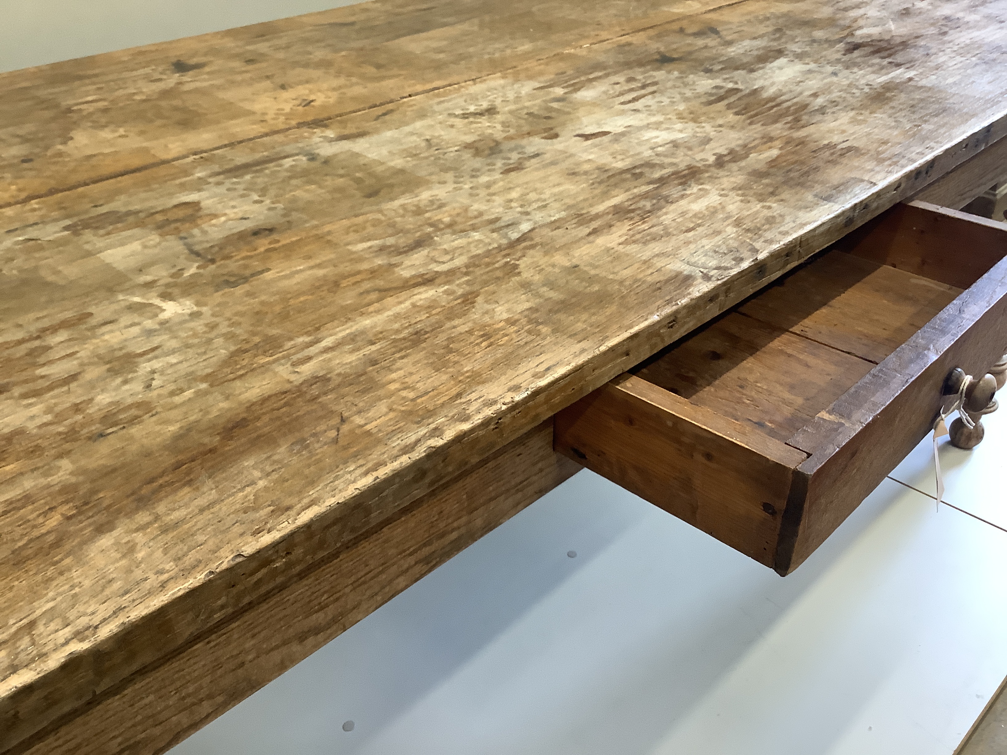 A 19th century French rectangular oak and fruitwood kitchen table, fitted drawer, width 202cm, depth 90cm, height 74cm